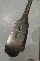 Close-up of hallmarks on handle