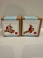 Front view of two Threadfollower felt fox sewing kits in boxes