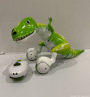 Robot dinosaur and remote side view