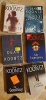 Six Dean Koontz novels laid out: False Memory, Innocence, Dark Rivers of the Heart, Life Expectancy, The Good Guy, Odd Thomas