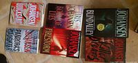 All six Iris Johansen books laid out, titles visible