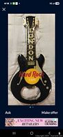 Front view of guitar-shaped Hard Rock Cafe London bottle opener pin