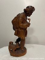 Front right view showing traveler figure, staff, dog, and base