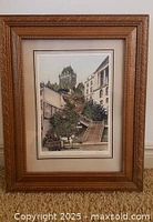 Front view of framed architectural print with carved gilt frame