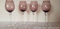 Group of four purple gradient etched wine goblets