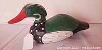 Left profile of wooden duck decoy