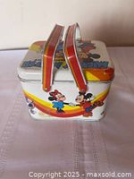 Side view showing dual red handles and Mickey & Minnie on rainbow