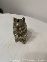 Front view of silver plated squirrel coin bank showing detailed fur and upright pose