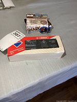 Both boxed tuners on table: Wittner GT 2 and Snark clip-on