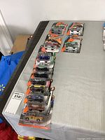 Full lot of 13 sealed Matchbox cars on table
