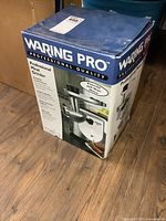 Front three-quarter view of Waring Pro meat grinder box