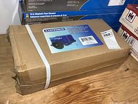 Sealed KastForce panel dolly box on wood surface