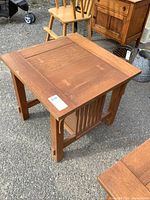 Full view of oak mission style end table showing square top, slatted sides, finish condition