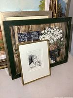Three framed pieces grouped: still-life, sketch, landscape
