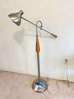 Full view of adjustable swing-arm floor lamp