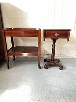 Pedestal side table and tea cart side by side