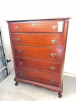 Front full view of five-drawer tall chest showing overall style, pulls, legs