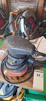 TMT sander on stack of discs, Ridgid circular saw behind