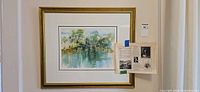 Full view of framed watercolor painting on wall