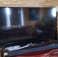 Front view of Samsung 50-inch TV on stand