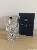 Front view of Bohemia crystal vase beside original box