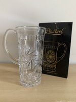 Pitcher beside original Pinwheel printed box
