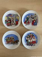 All four plates showing different Christmas scenes