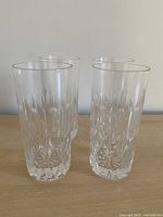 Four cut crystal highball glasses grouped