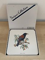 Box opened showing one placemat and Jason Designer Collection branding