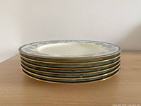 Stacked view showing edge pattern and gold trim