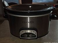 Front view of stainless Crock-Pot with lid