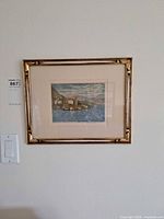 Framed aquatint on wall