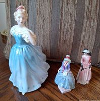 Front view of all three Royal Doulton figurines