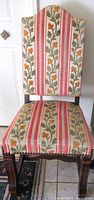 Full view of oak chair with floral stripe upholstery