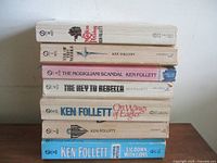 Stack of Ken Follett paperbacks showing spines