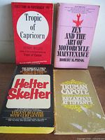 Group shot of all four paperback books arranged two by two