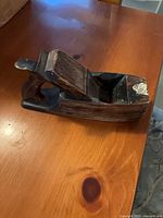 Top oblique view of wooden plane showing body, tote and wedge
