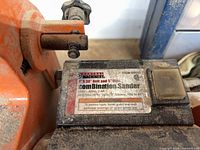 Close-up of Central Machinery label on sander showing model, belt and disc sizes