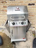 Front view of Char-Broil stainless steel 2-burner grill with lid closed