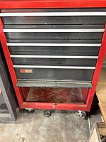 Front view of Craftsman rolling cabinet showing drawers, color scheme, casters, wear