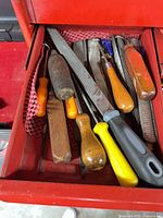 Drawer showing mixed files and screwdrivers