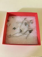 Silver-tone charm chain, studs and clear beads in box