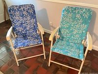 Both folding patio chairs front view