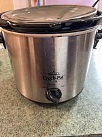 Front view of stainless Rival Crock-Pot showing control knob, lid, and exterior condition