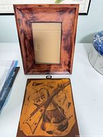 Frame and plaque together showing relative size and design