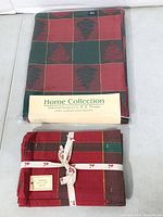 Packaged tablecloth and bundled napkins showing matching pattern