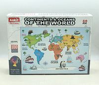 Front of sealed box showing puzzle image, brand, piece count, size and age rating