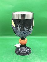 Front view of goblet showing scene and pumpkin stem