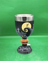 Front view of goblet showing moon scene and pumpkin stem