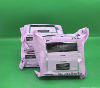 Front view of three sealed Equate Beauty facial cleansing wipe packs